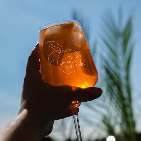 Aperolglas 'Let's get aperold together' pinke distel